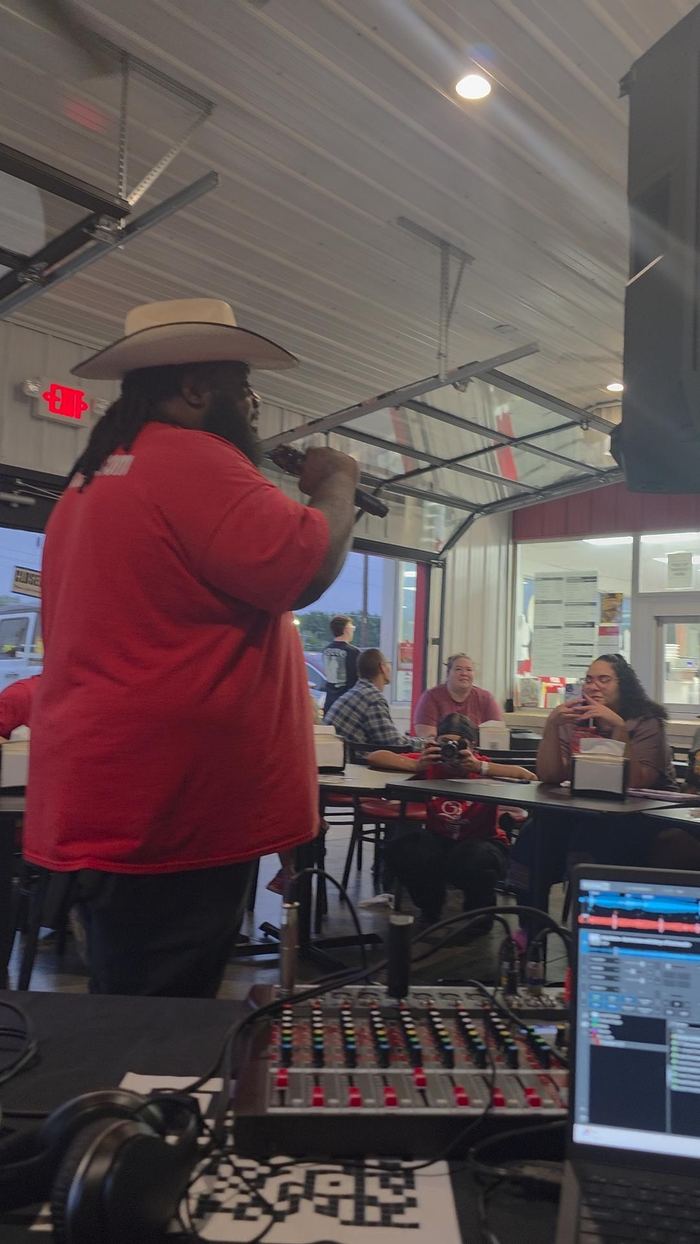 DJ Sir Uso hosting and emceeing at a community karaoke event